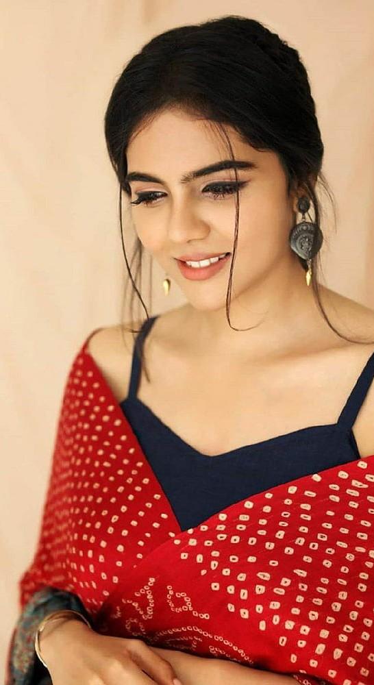 Smiling Kalyani in Red Dupatta with Bun Hairstyle Image