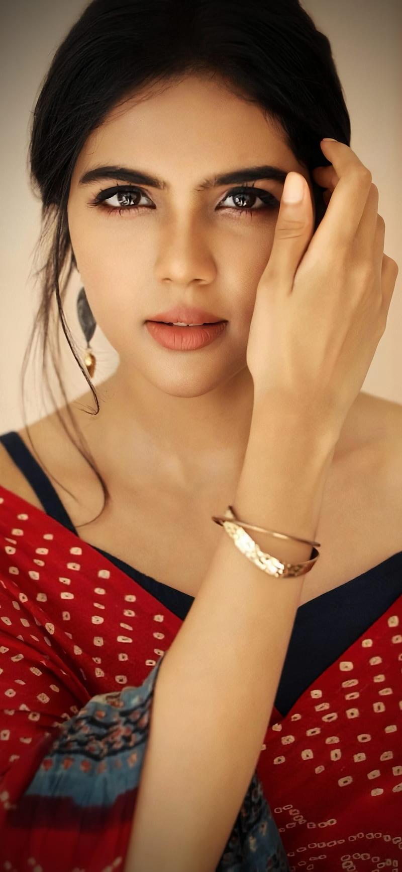 Stylish Kalyani in Red Polka Dot Dress Touching Face Pic