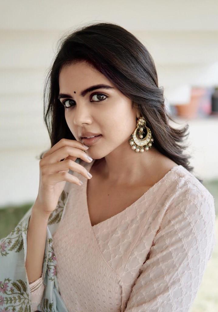 Thoughtful Kalyani with Earrings Posing Indoors free Image