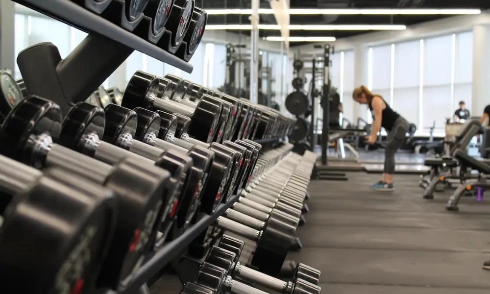 beginner gym guide person hesitating outside gym door