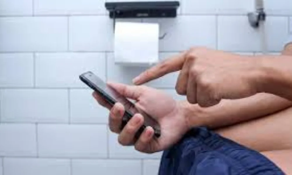 Phone use in toilet health risks 2025