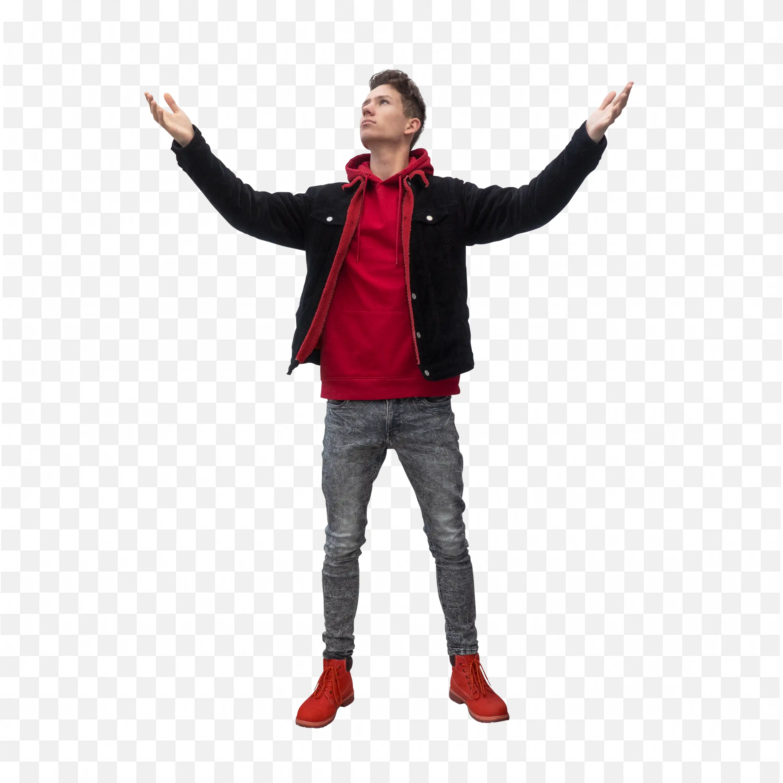 Young Man Wearing Red Hoodie with Arms Raised Outdoors Png