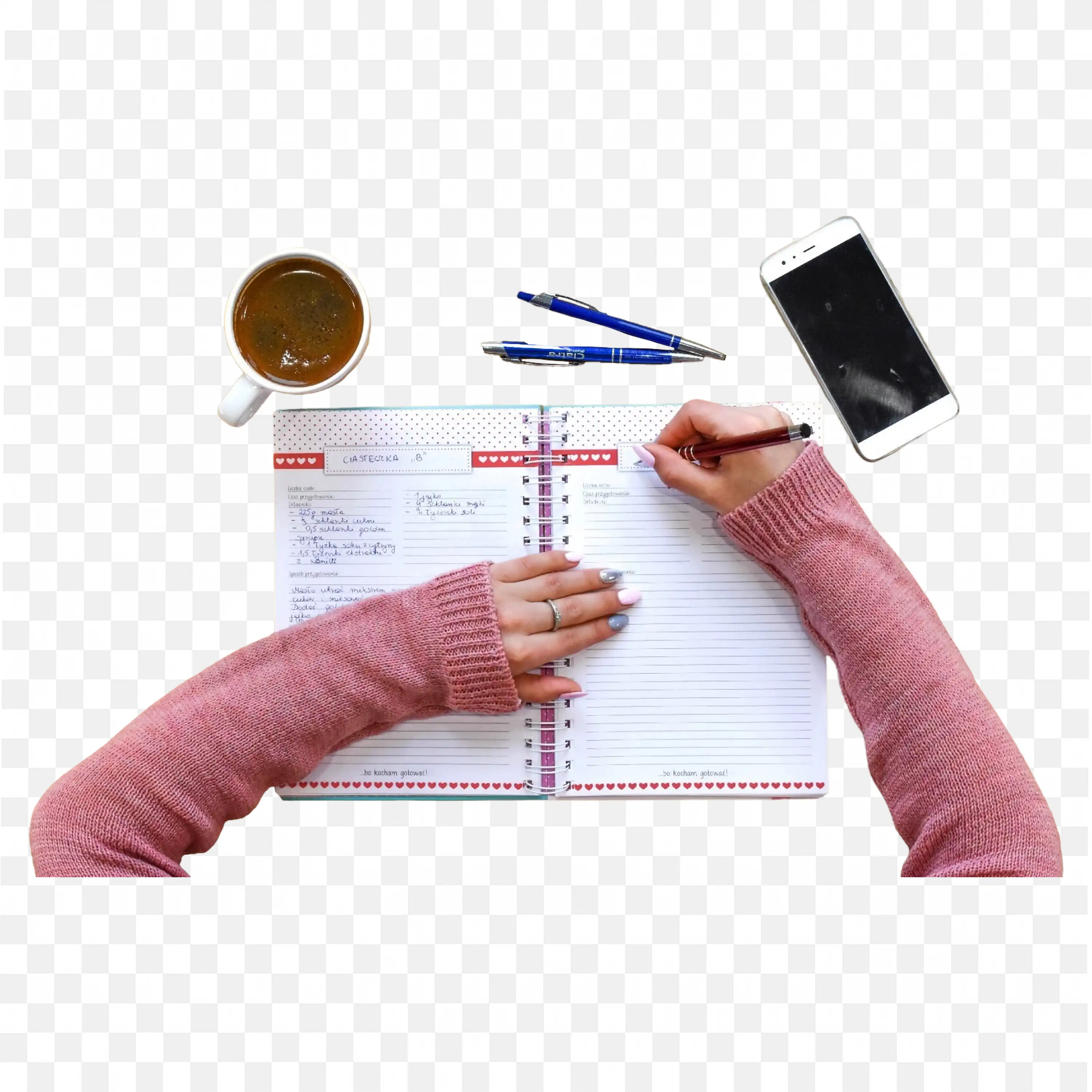 Person Wearing a Pink Sweater Writing in a Recipe Notebook