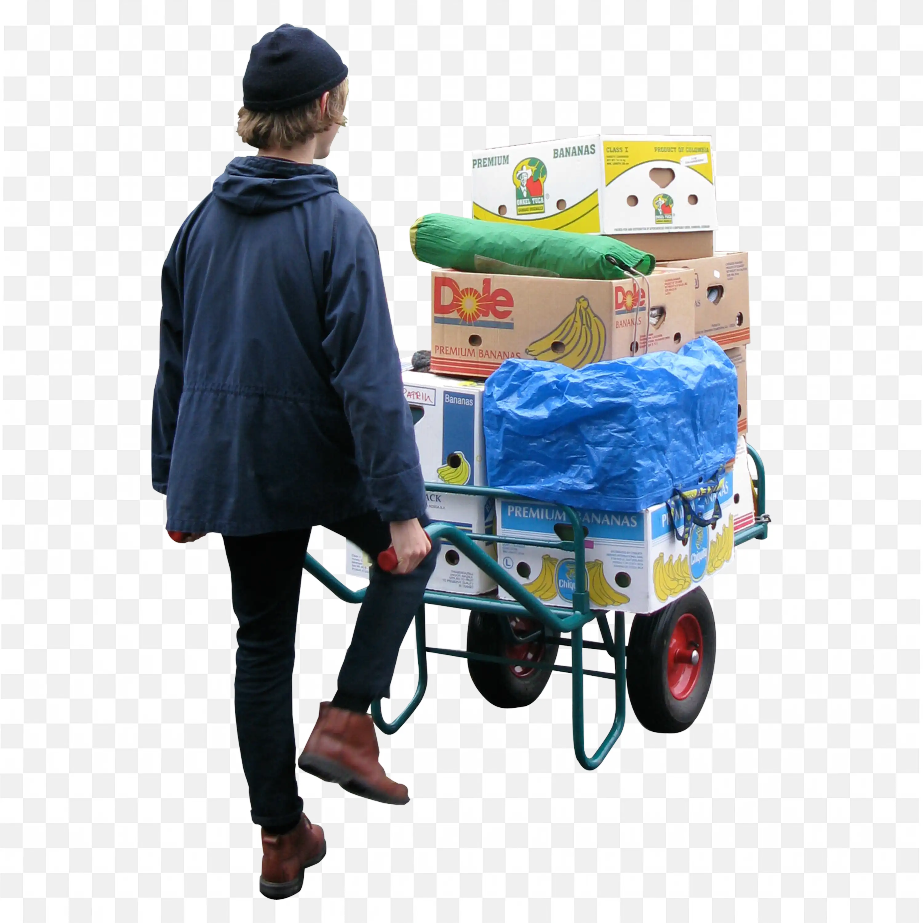Man in Blue Jacket Pulling Cart with Boxes Walking Outside