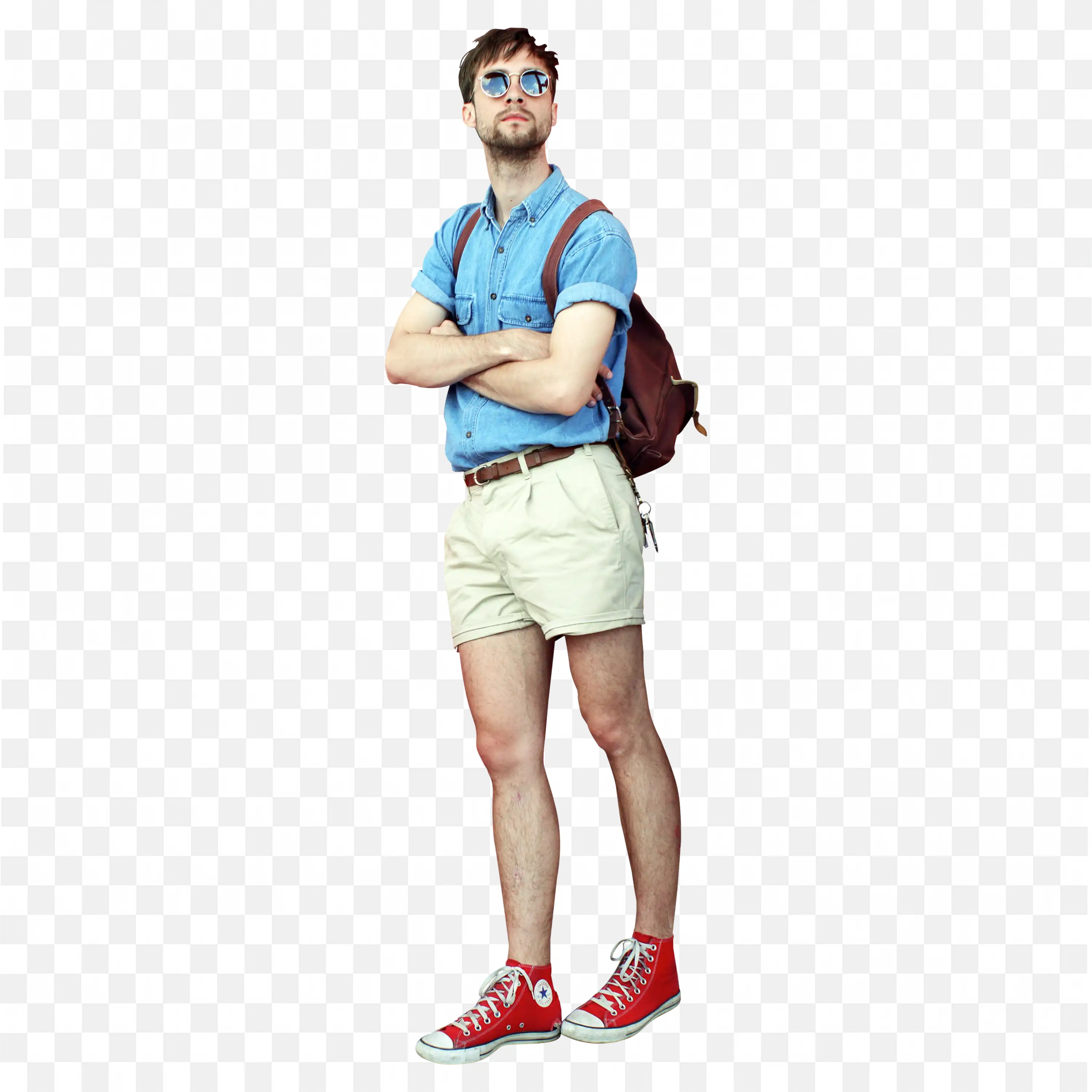 Man with Blue Shirt and Shorts with Red Sneakers Standing