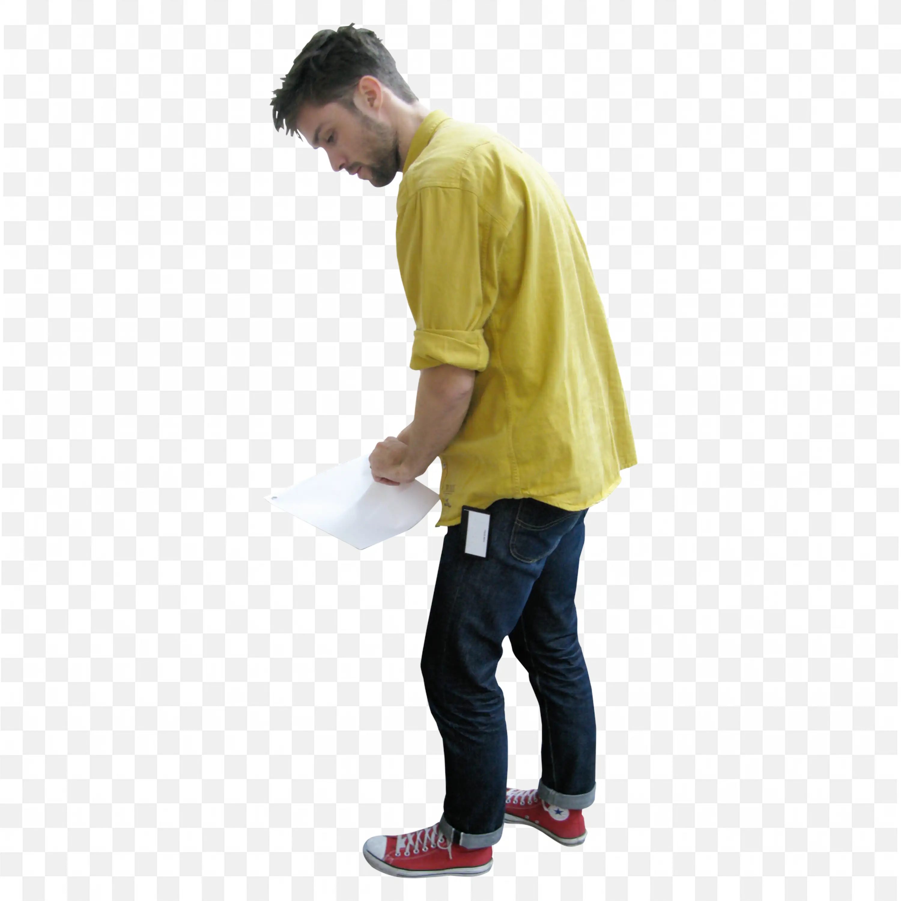 Man in Yellow Shirt Looking at Paper in Hand Free Png