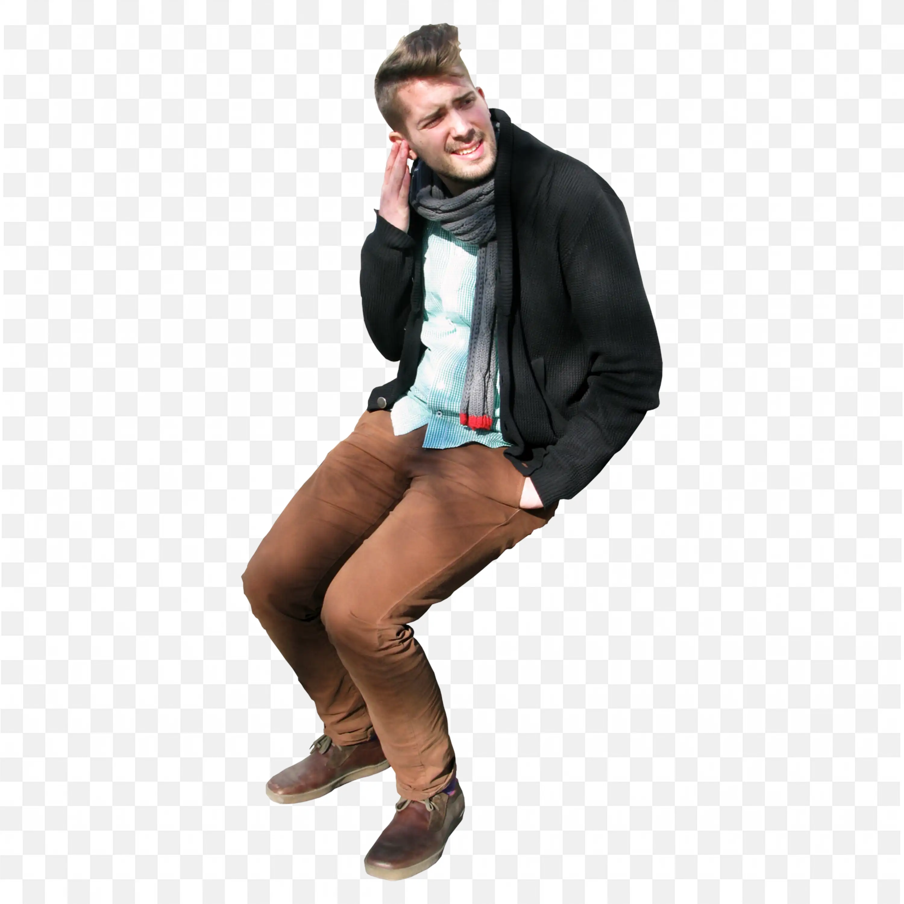 Smiling Young Man Sitting Casually with His Hand on Ears