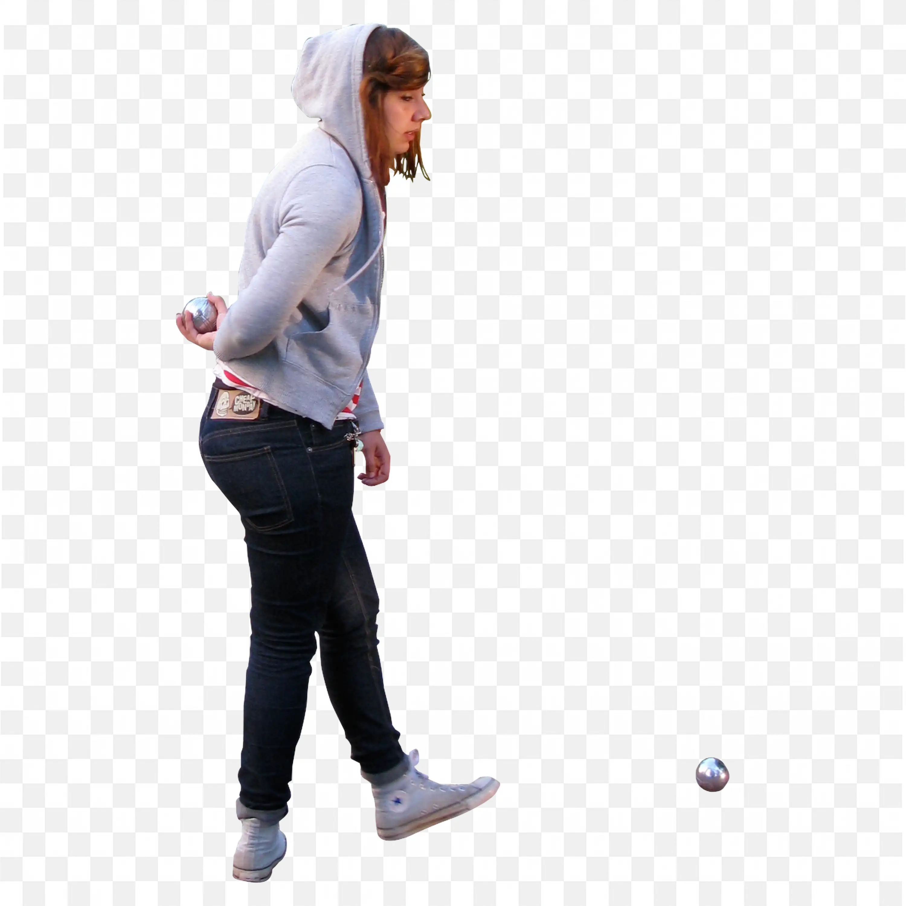 Woman in Hoodie Leaning Forward Holding a Small Silver Balls