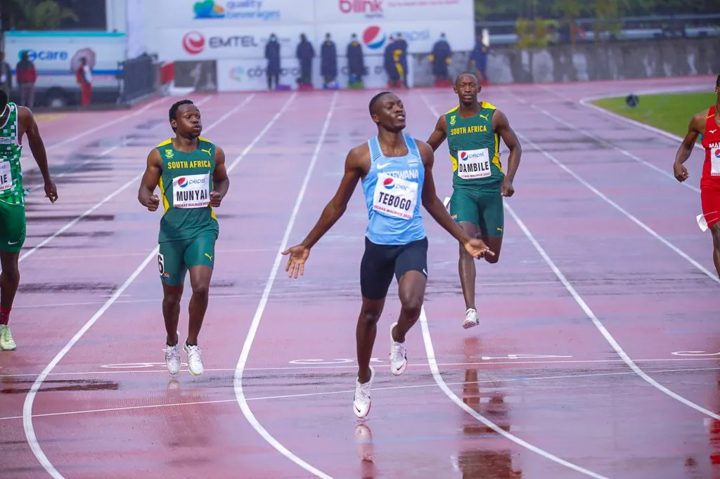 Letsile Tebogo competing with athletes in a sprint track event