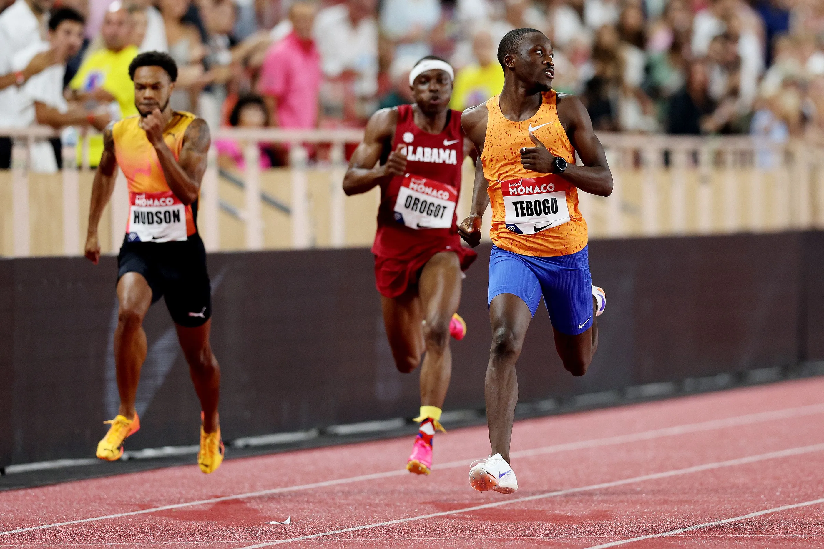Letsile Tebogo competing closely with sprinters in athletics race