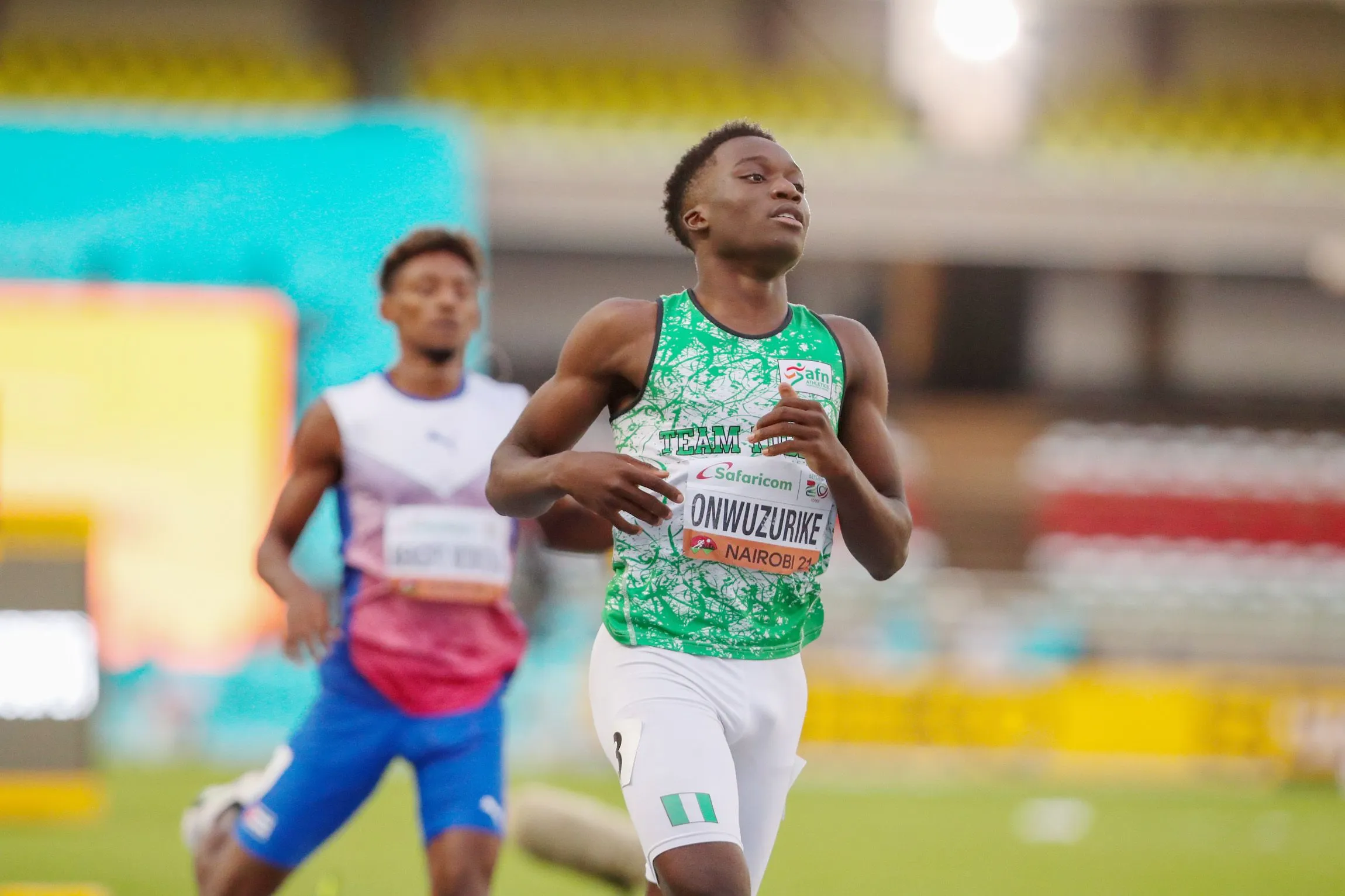 Letsile Tebogo running with strength in an outdoor track race