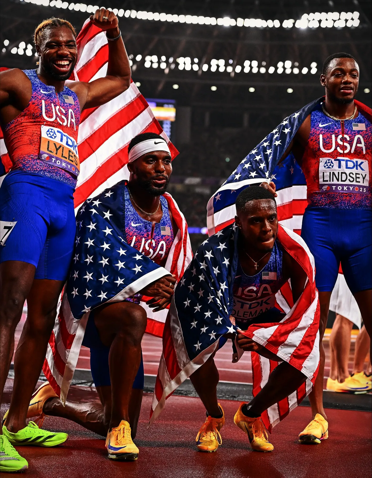 Noah Lyles Celebrates Gold with Teammates