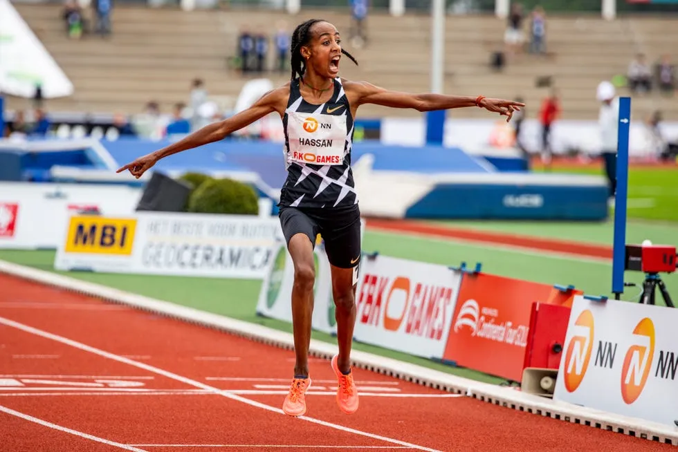 Sifan Hassan running confidently in a middle-distance race