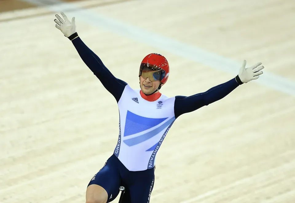 Jason Kenny Triumphs with Arms Raised