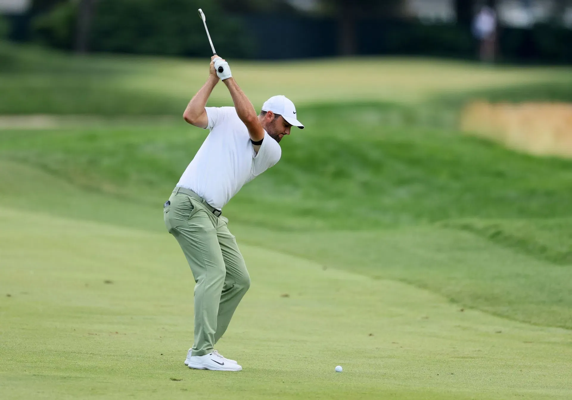 Scottie Scheffler Executing an Iron Shot