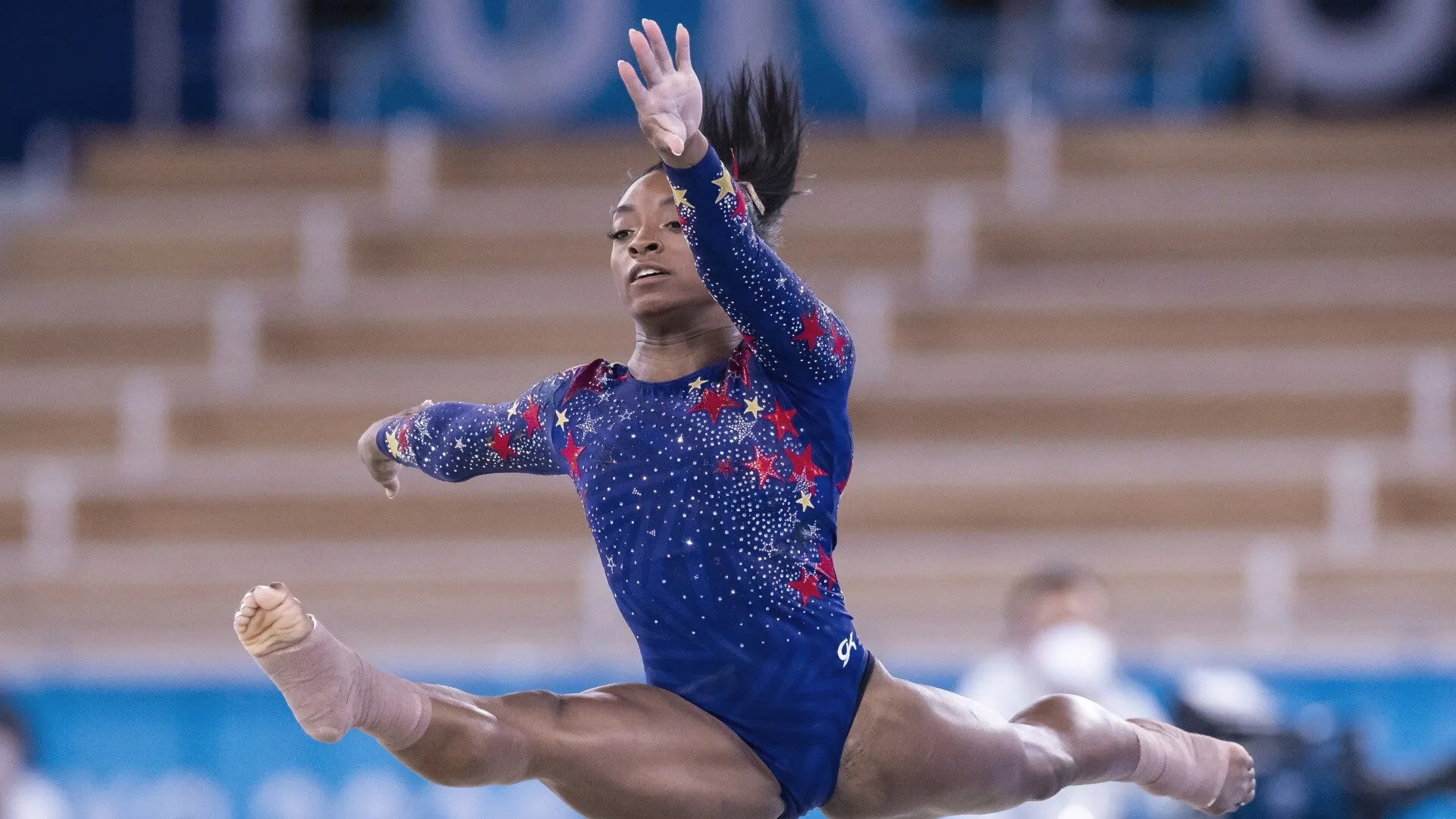 Simone Biles Uneven Bars Performance Wallpaper