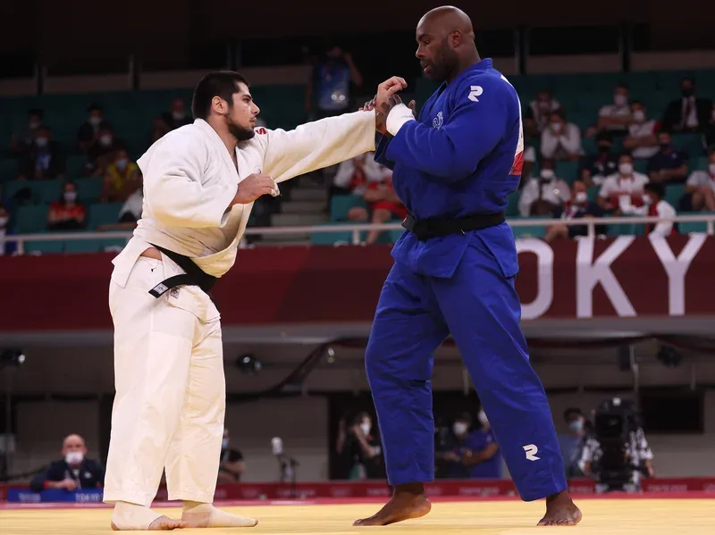 Teddy Riner gripping opponent in match