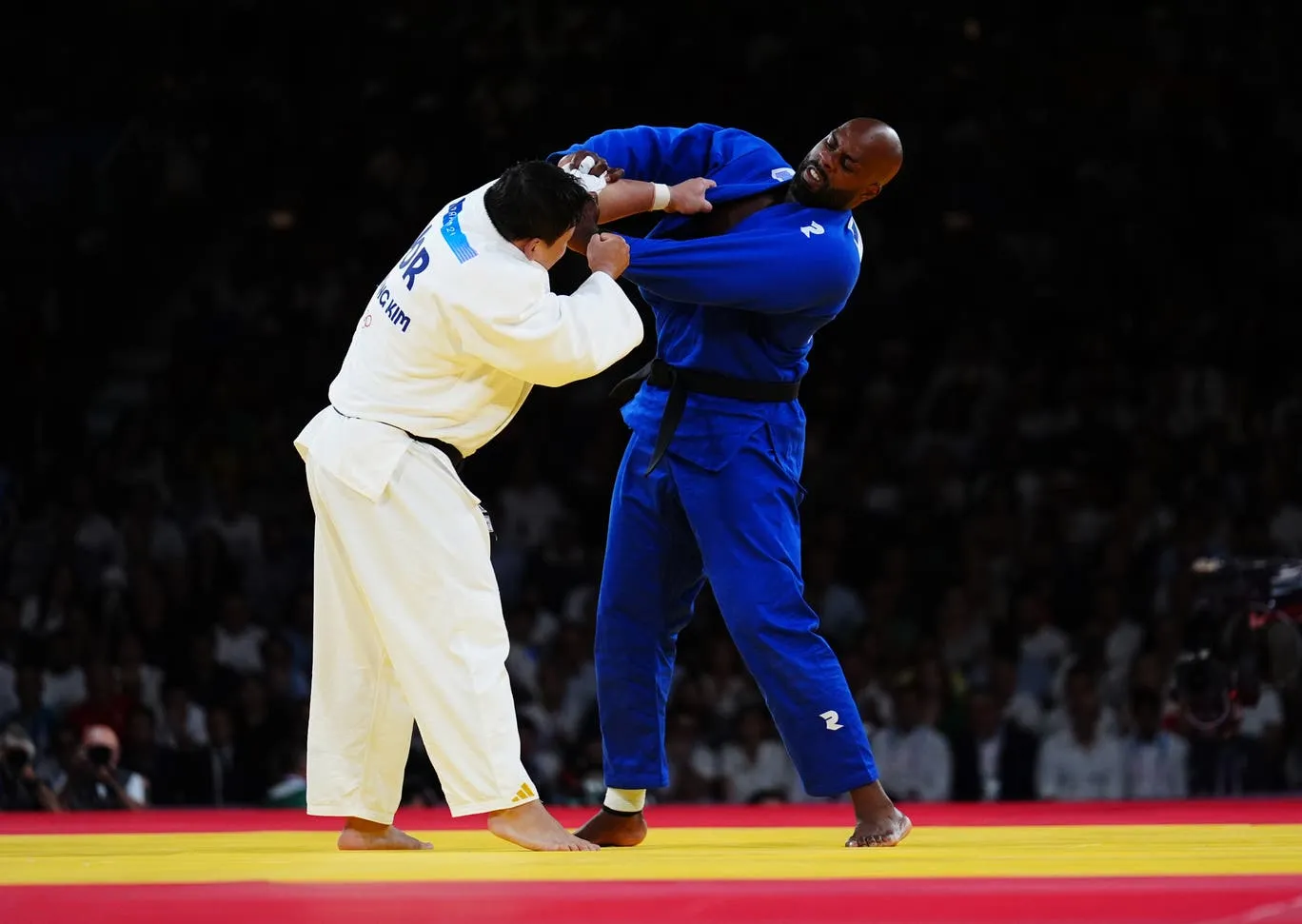 Teddy Riner performing flying judo throw