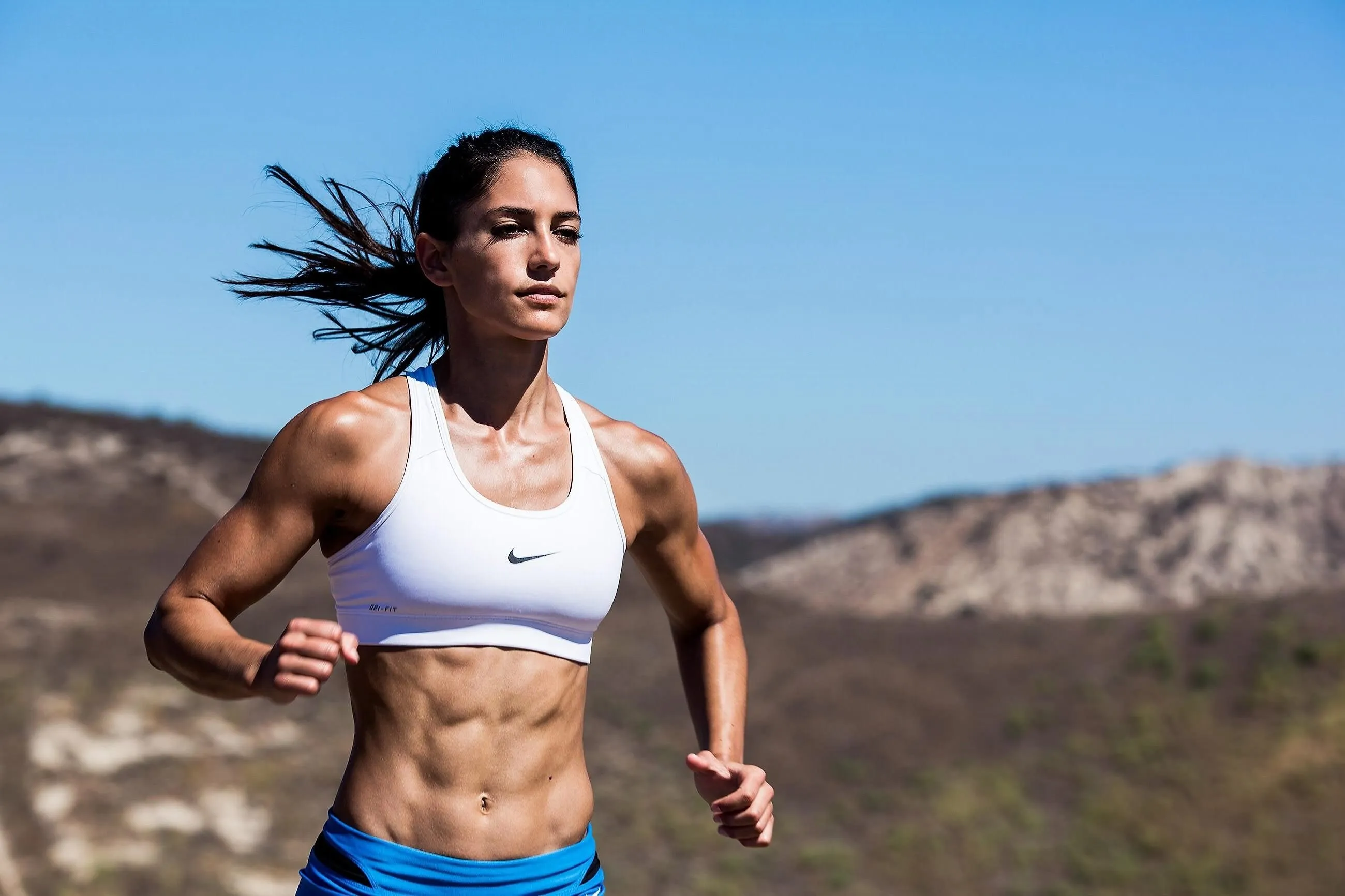 Allison Stokke Strength Pose in Sports Field
