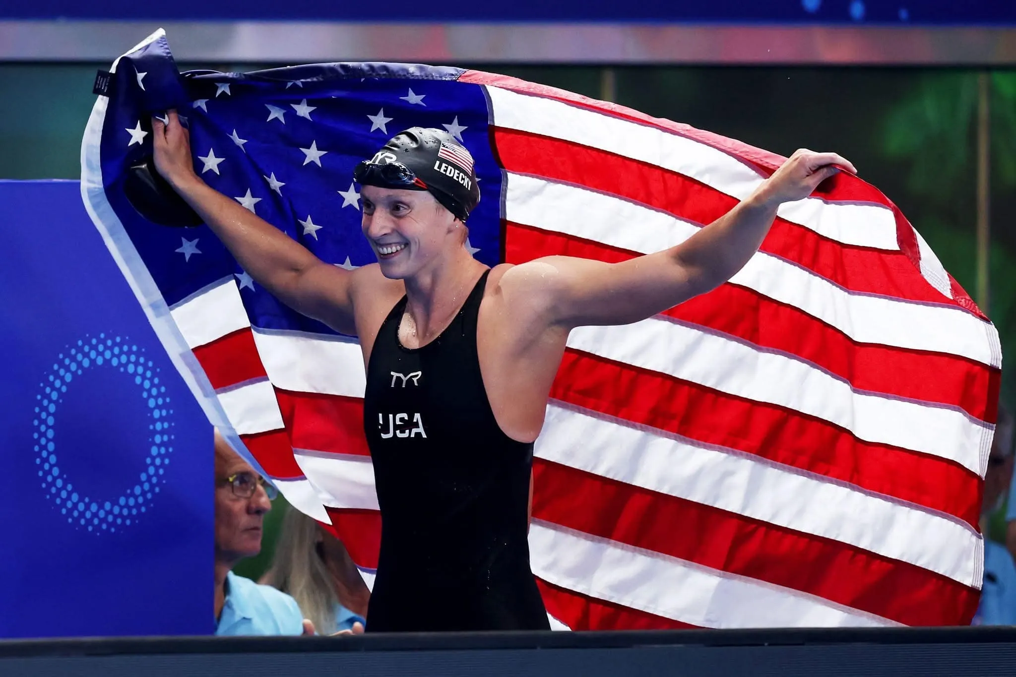 Katie Ledecky Celebrating Victory with American Flag in Swimming