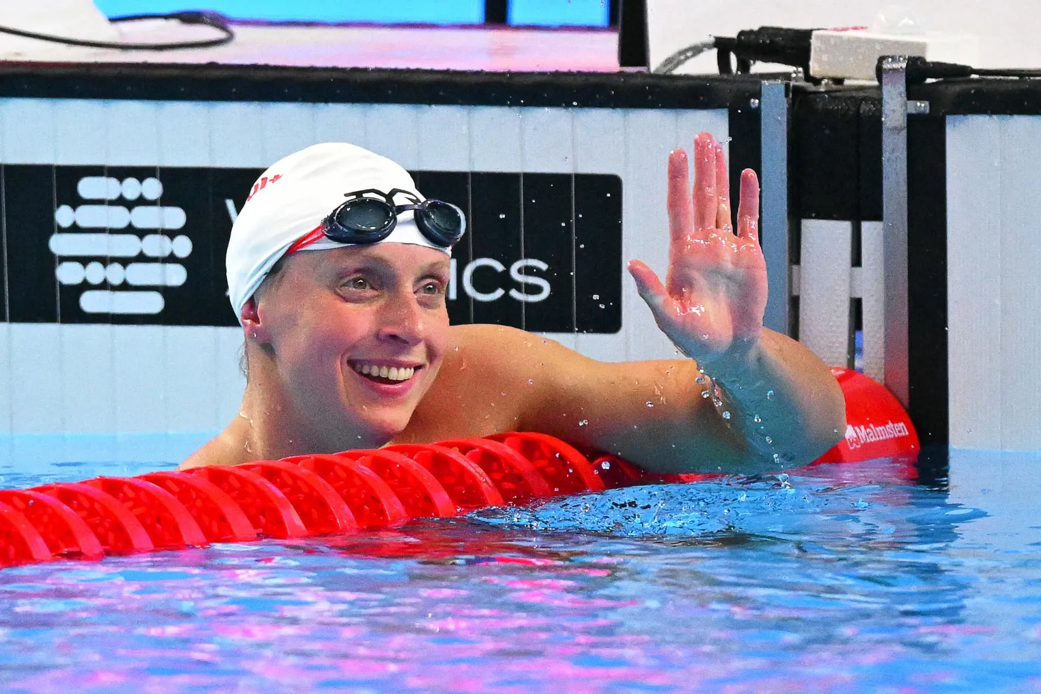 Katie Ledecky Resting at Poolside After Swimming Competition