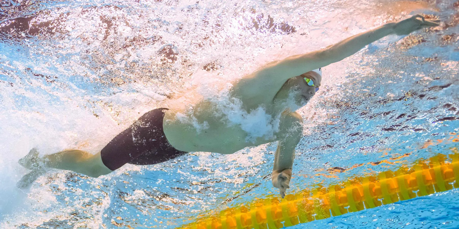 Leon Marchand Competing with Precision in Professional Swimming Event