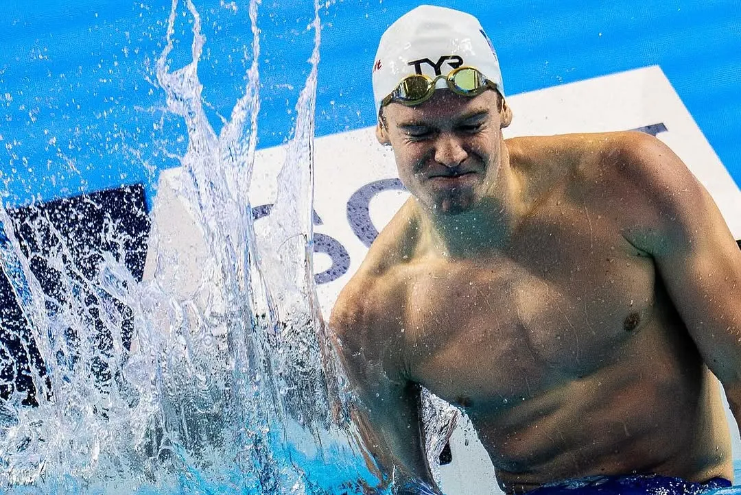Leon Marchand Showing Determination in Swimming Competition Finish