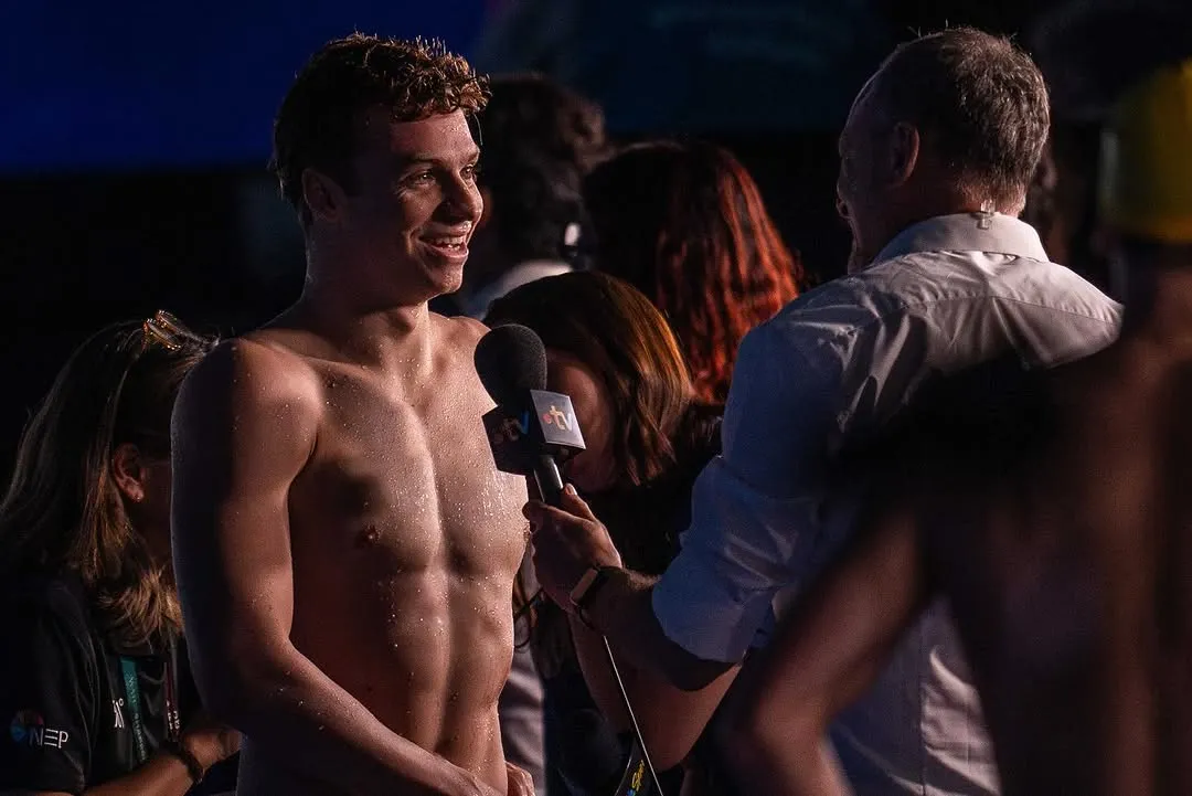Leon Marchand Celebrating Victory in Swimming with Powerful Pose