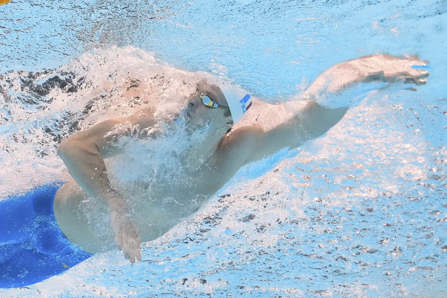 Leon Marchand Performing Freestyle Stroke in Swimming Competition