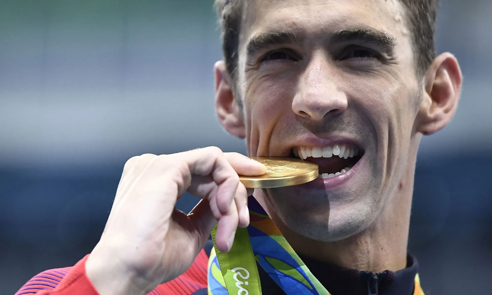 Michael Phelps Biting Gold Medal Wallpaper