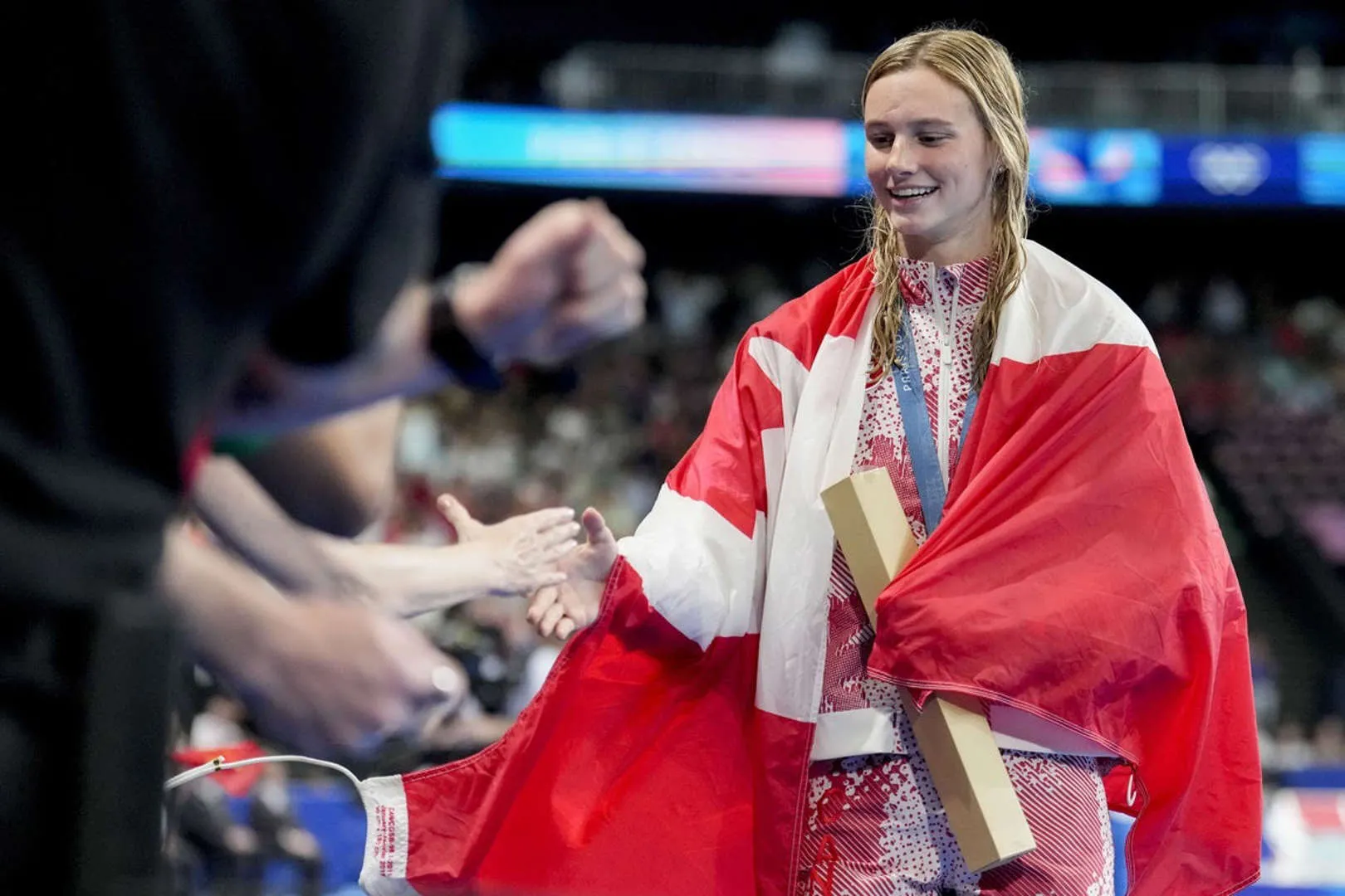 Summer McIntosh Posing with Medal After International Swimming Win
