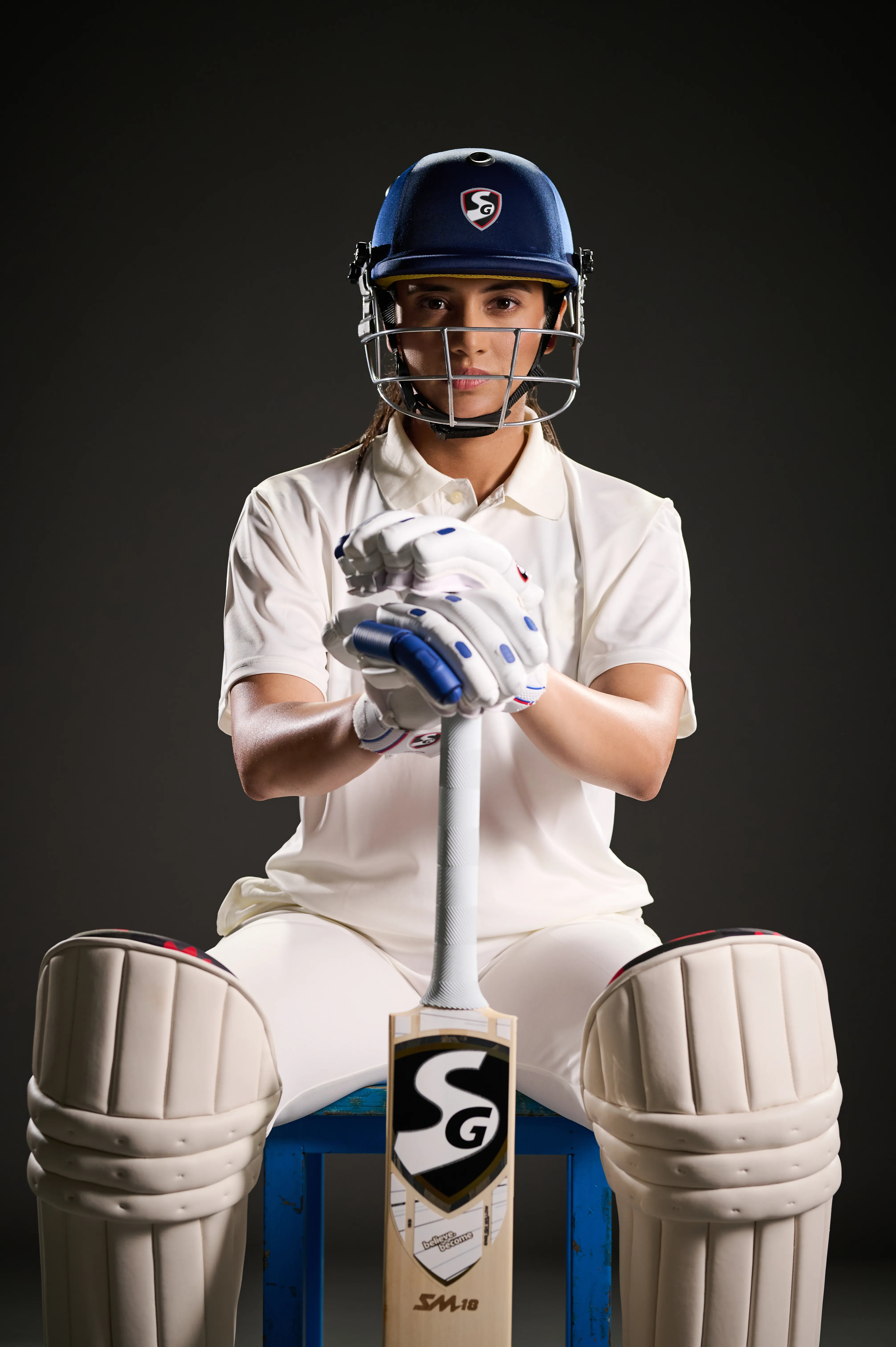 Smriti Mandhana Poses in Cricket Gear with Bat and Pads
