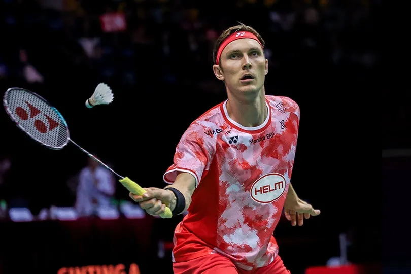 Viktor Axelsen in Red Kit During Tournament Play