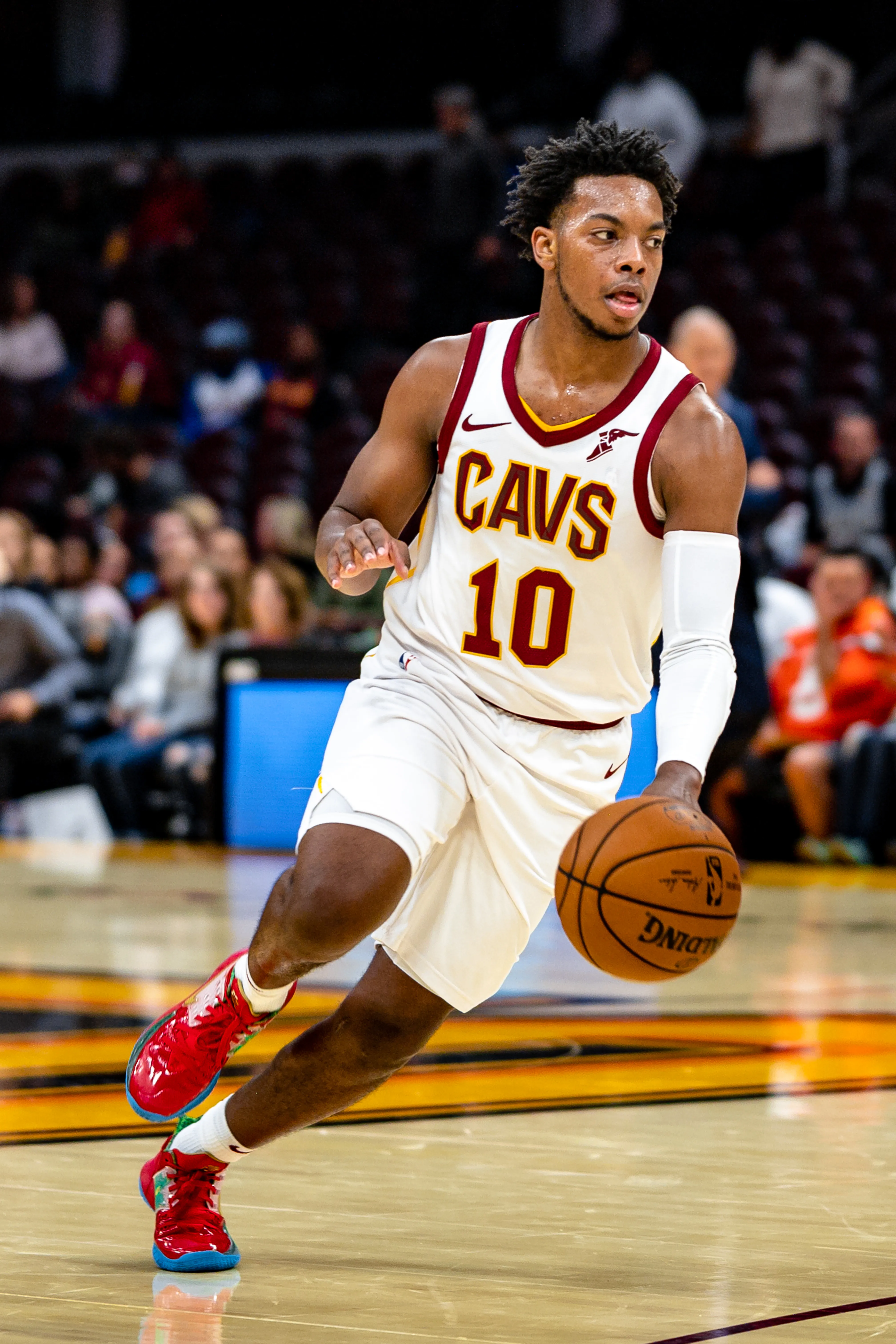 Darius Garland Handling the Ball in Classic Cavs White Jersey