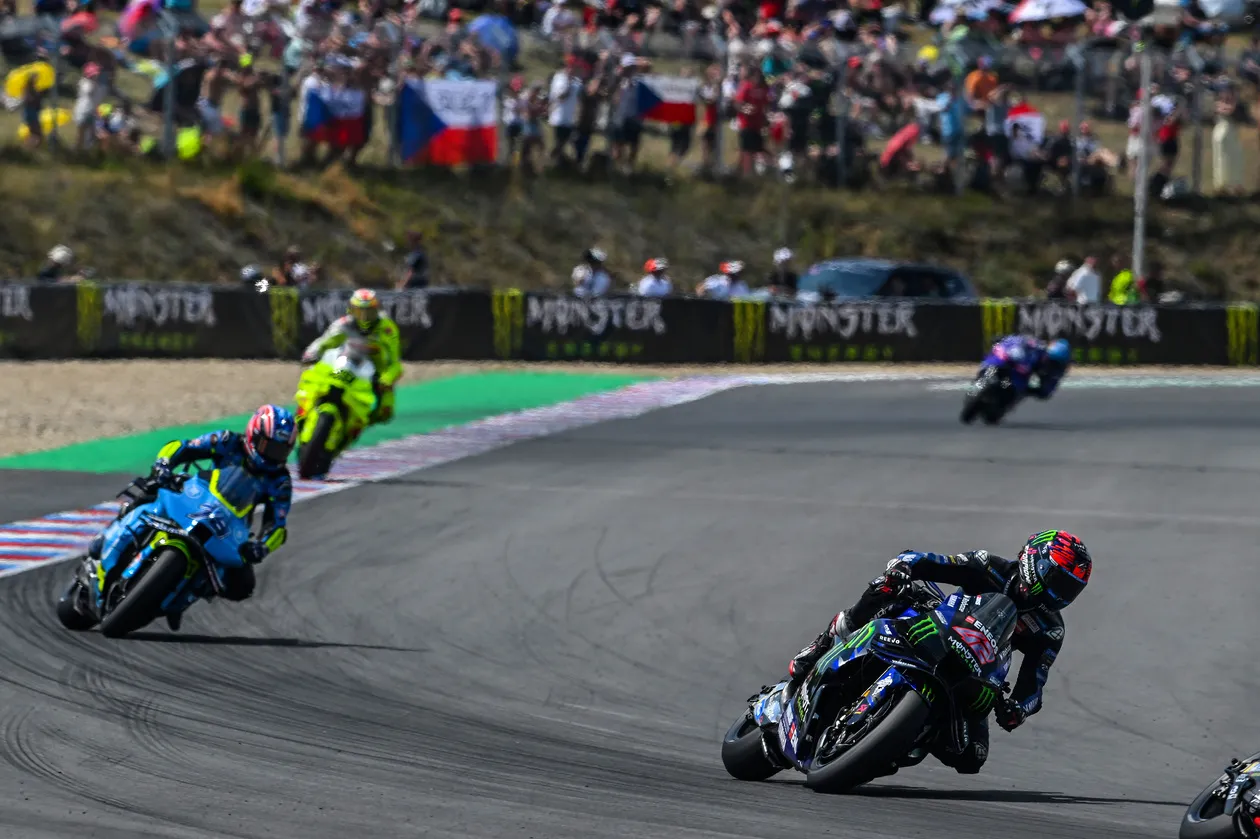 Alex Rins Competing in Front of Crowd at MotoGP Event