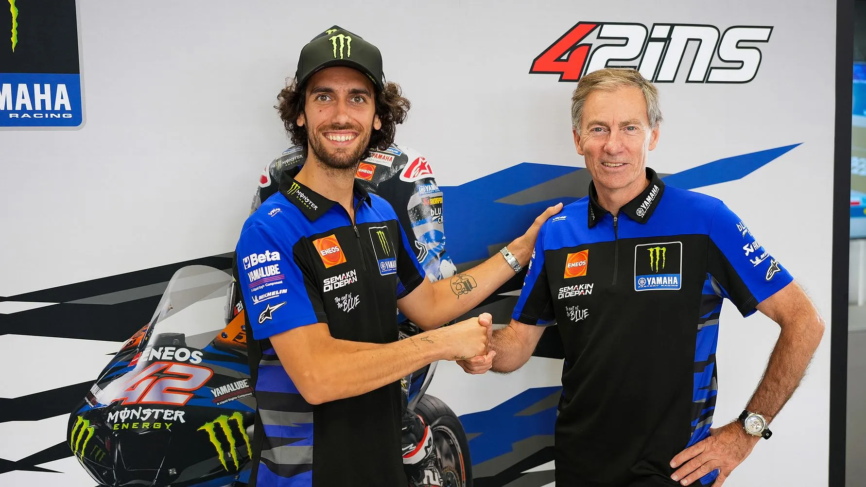 Alex Rins Shaking Hands in Yamaha MotoGP Paddock