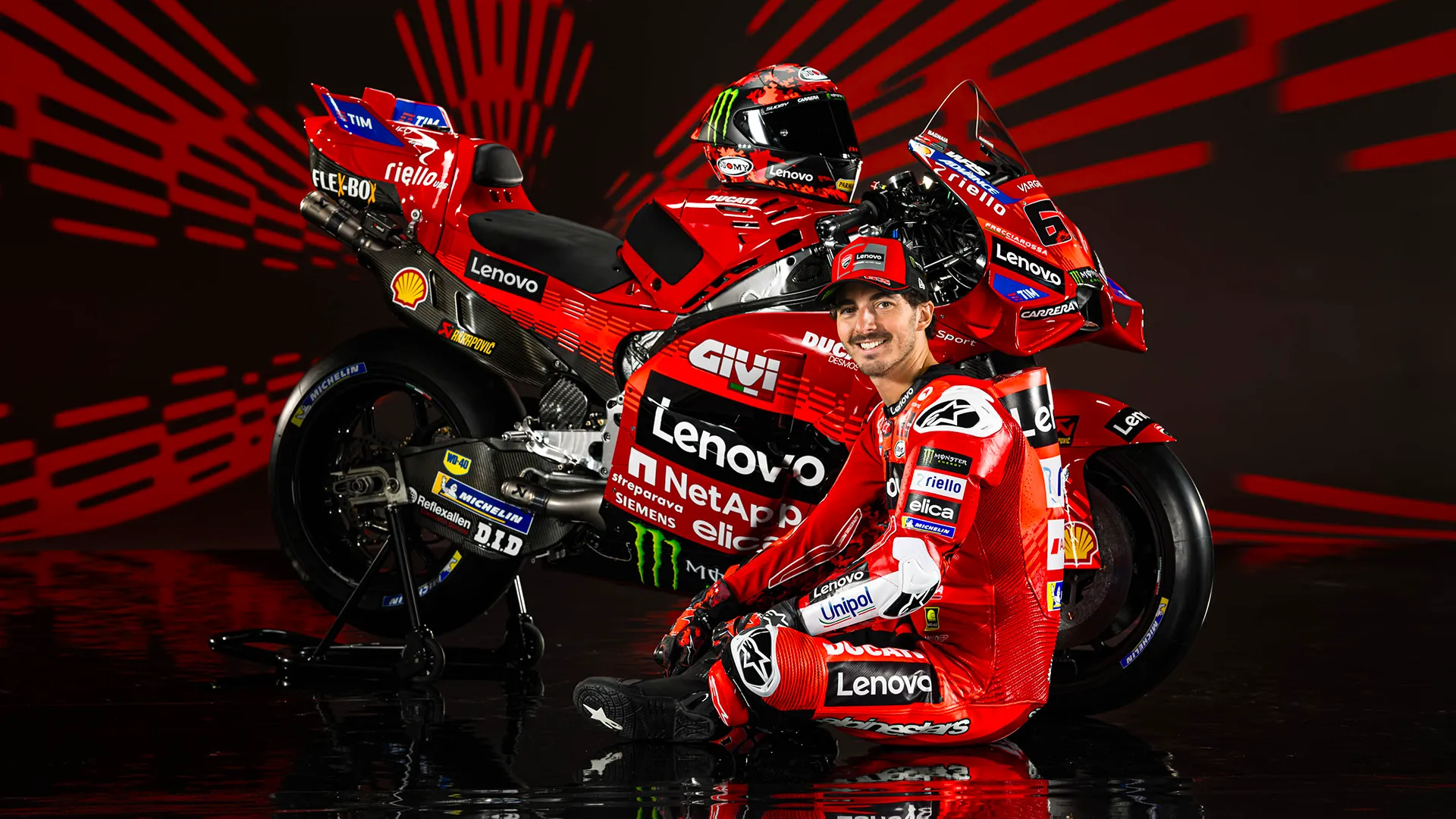Dynamic Ducati team photo featuring Francesco Bagnaia