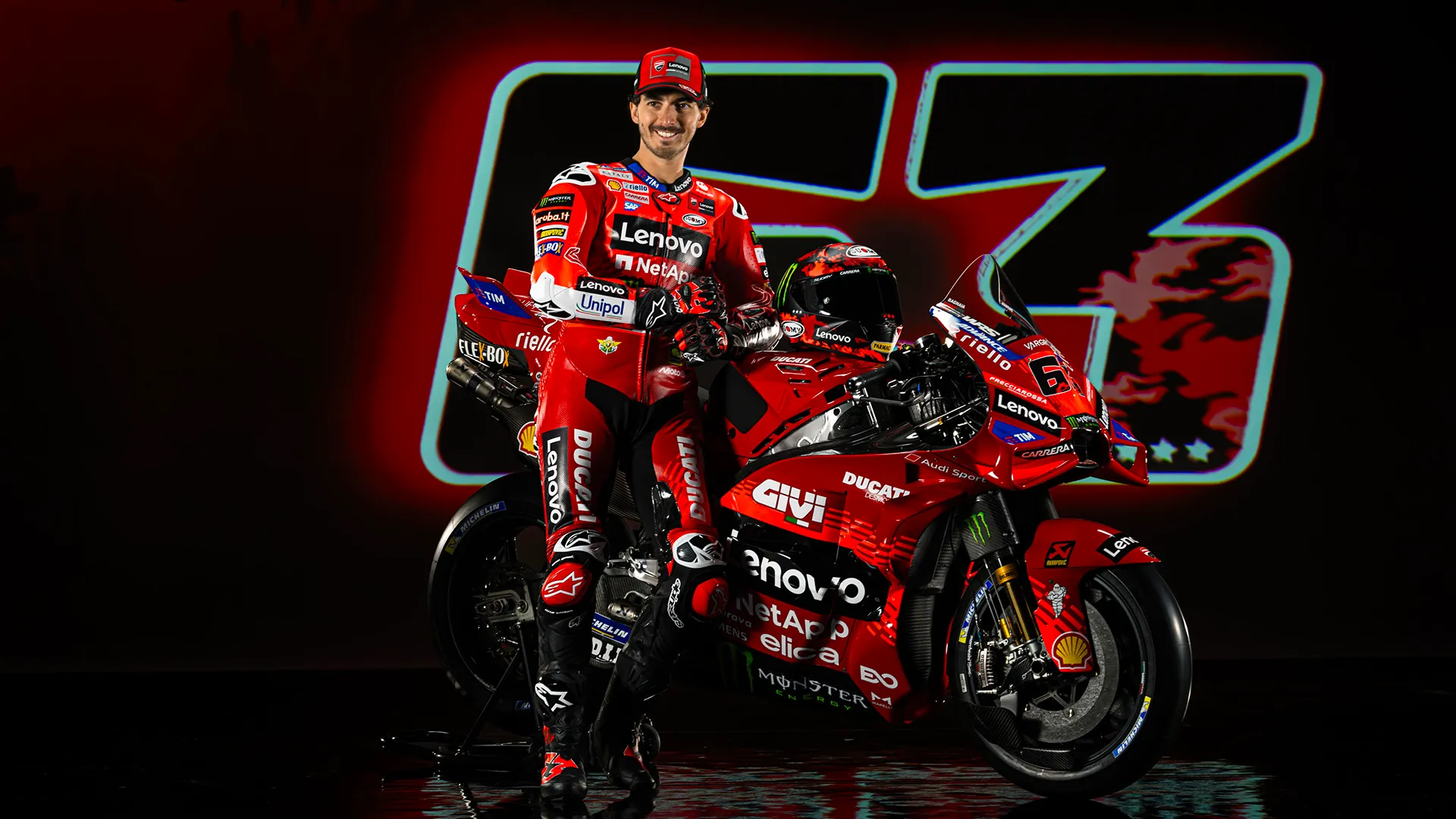 Francesco Bagnaia posing with his bike and championship number