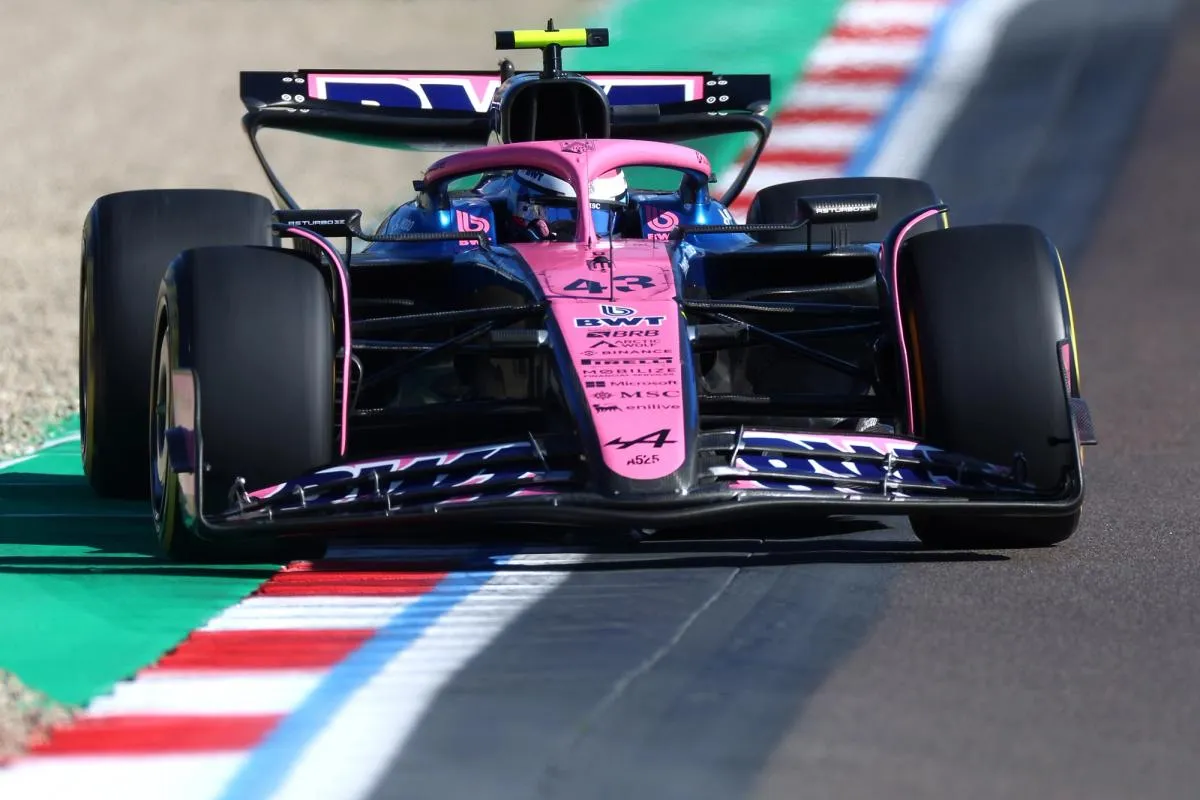 Alpine F1 Car Attacking the Apex at High Speed