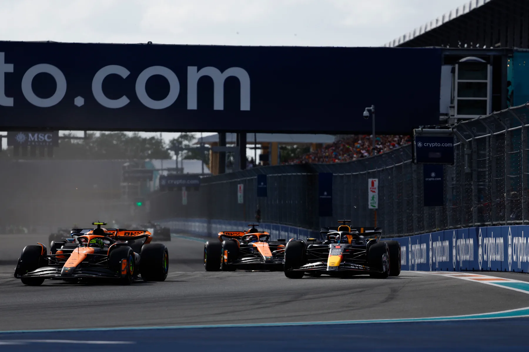 McLaren Cars Battle for Position on Tight Formula 1 Circuit