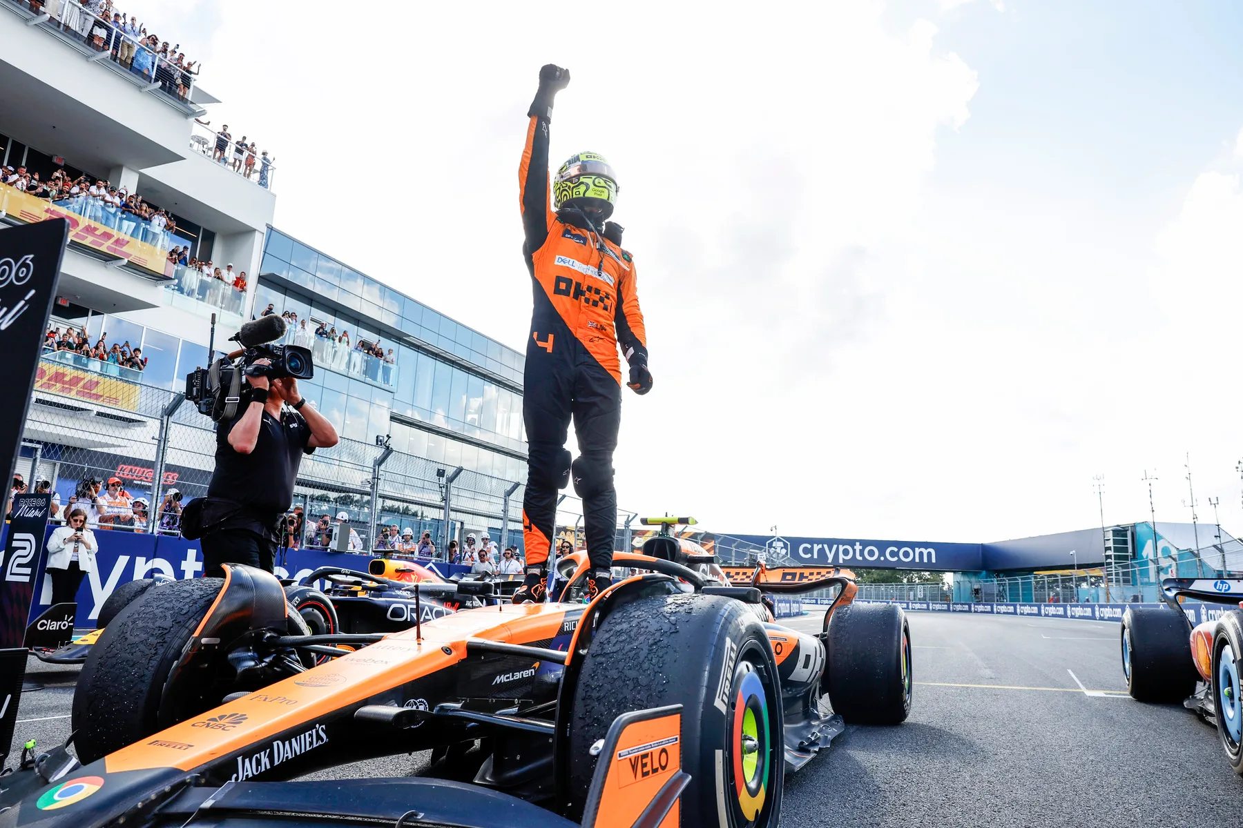 Lando Norris Celebrates Victory Standing on McLaren F1 Car