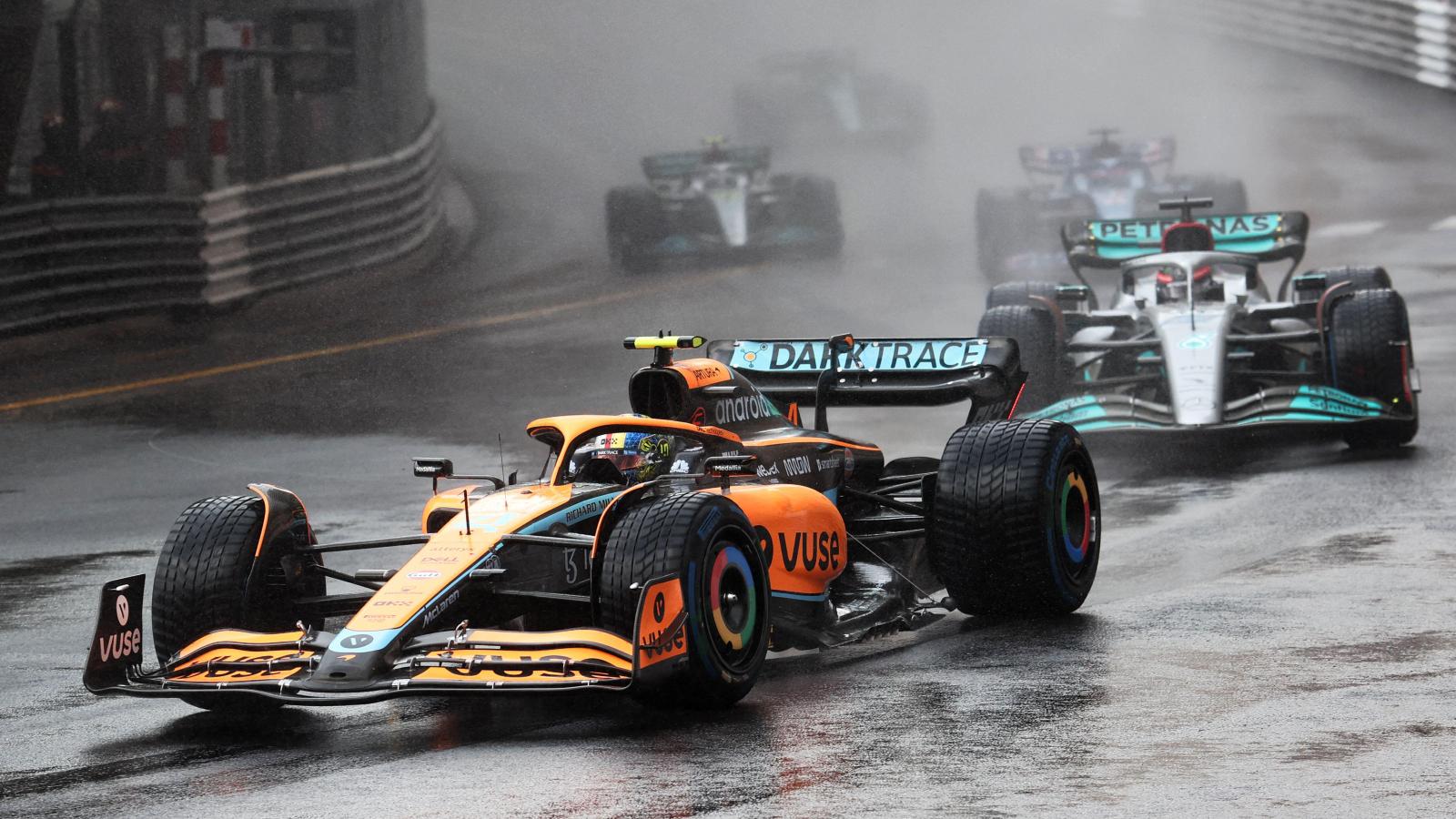 McLaren F1 Car Chases Rivals in Heavy Rain During Intense Race