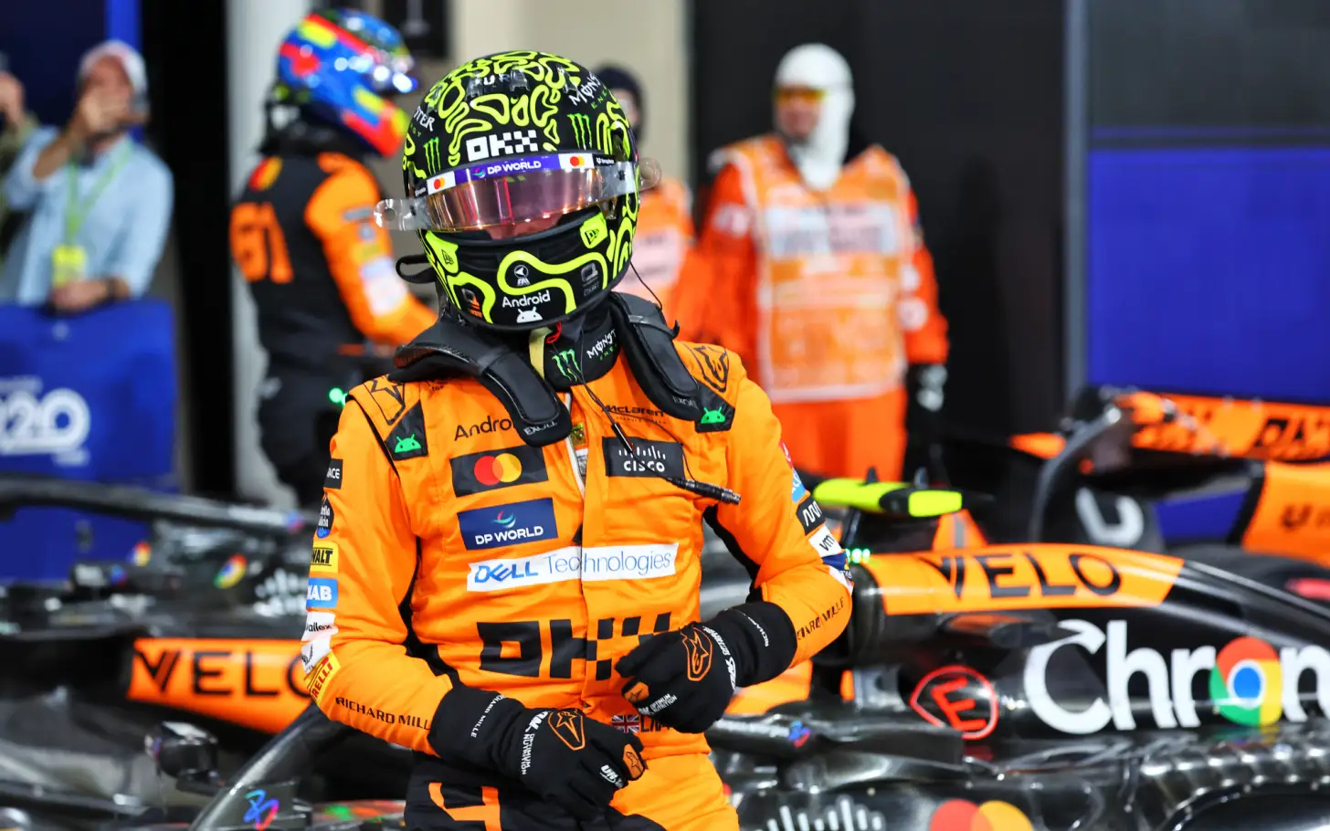Lando Norris Prepares for F1 Race with Intense Focus in Garage