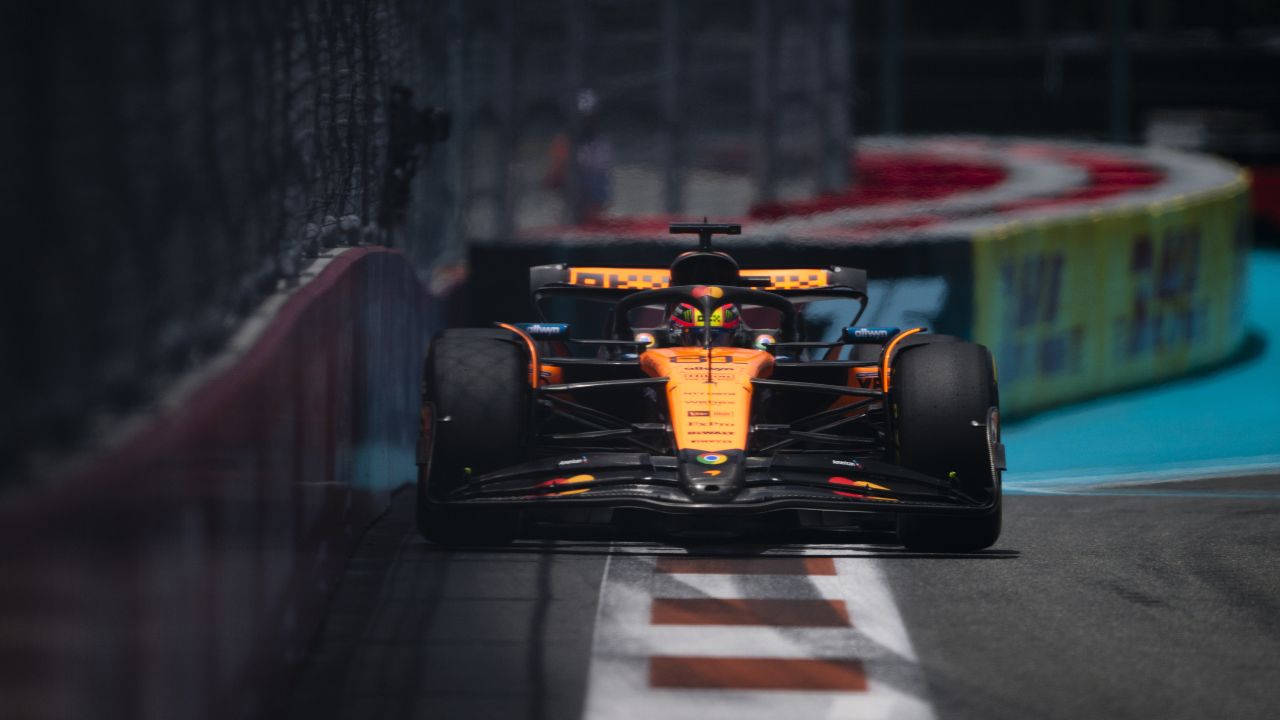 Rear View of Oscar Piastri Racing McLaren at Full Speed