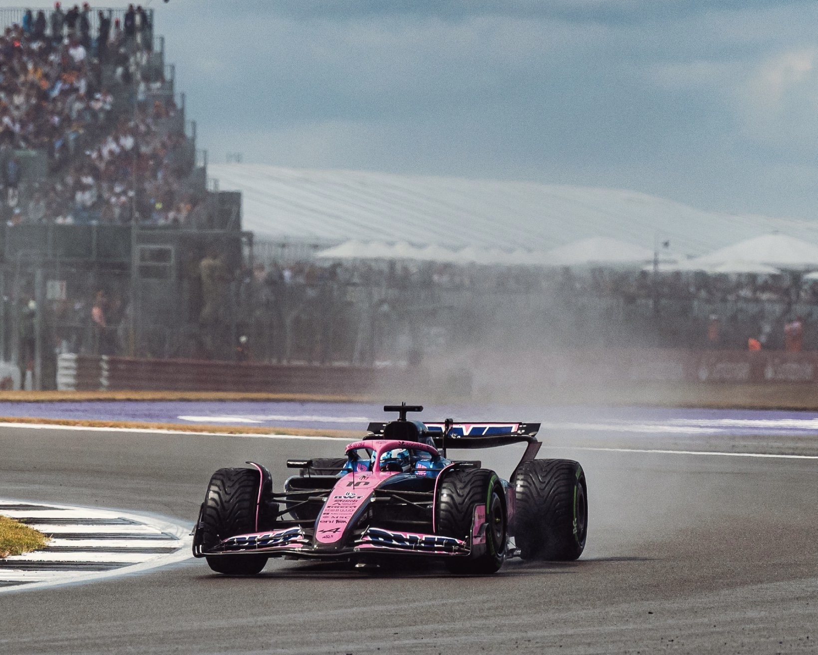 Pierre Gasly Racing on a Wet Track