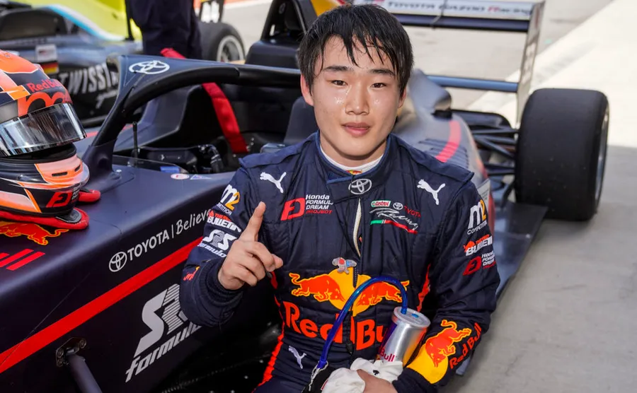 Yuki Tsunoda Gives Thumbs-Up in Formula 1 Pit Lane