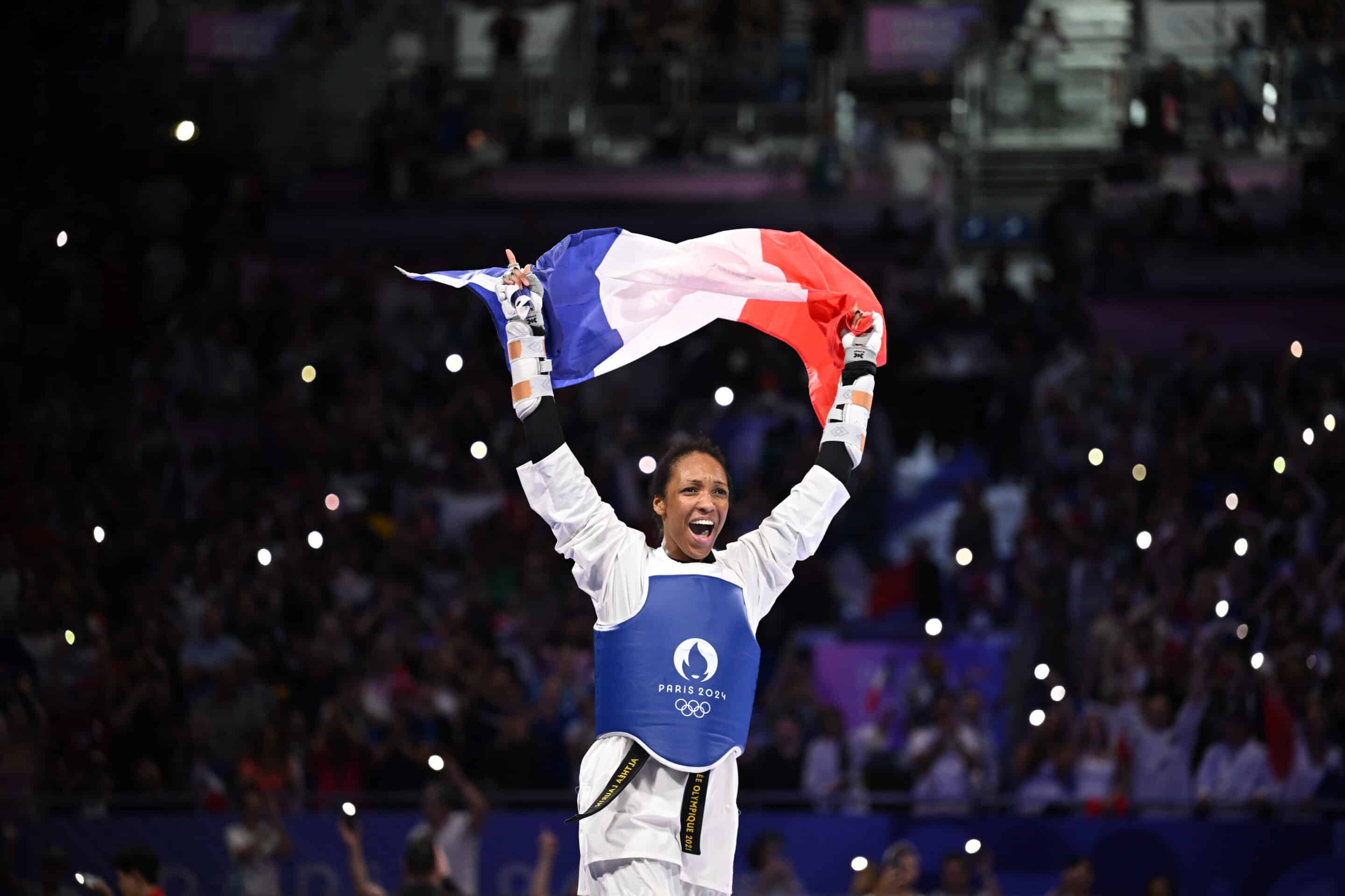 Althea Laurin Celebrating Victory with French Flag in Arena
