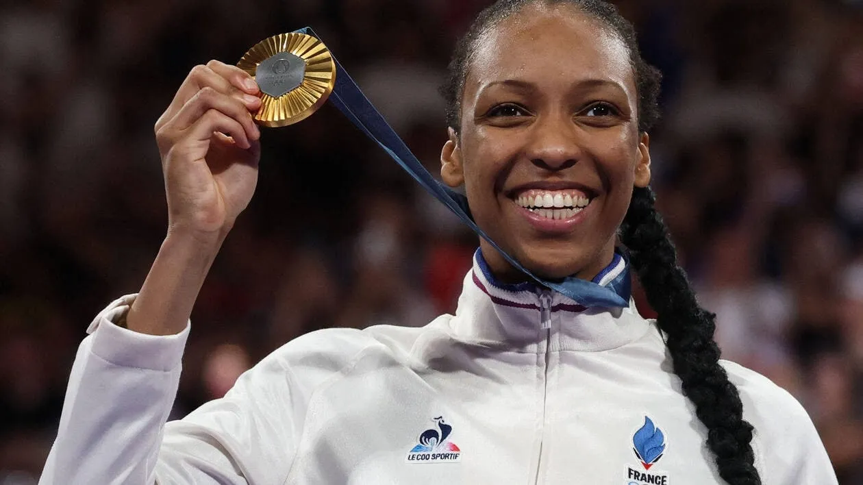 Althea Laurin Showing Gold Medal with Big Smile