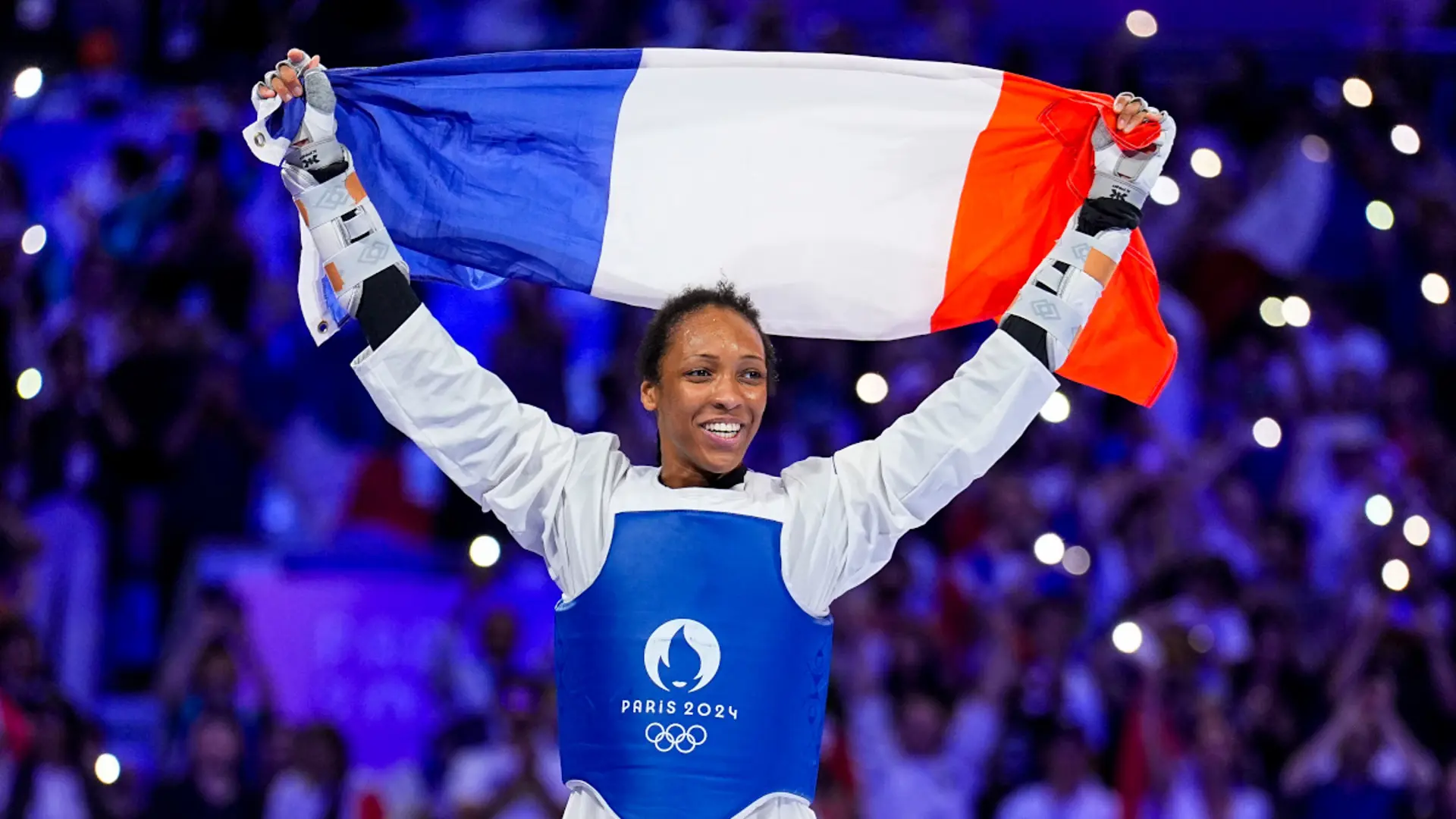 Althea Laurin Cheering with French Flag After Win