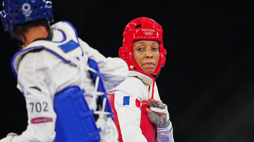 Althea Laurin Competing in Blue Gear at Taekwondo Match